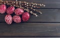 Still life with Pysanka, decorated Easter eggs, on black wooden