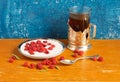 Still life. Raspberry with sour cream and a glass of tea Royalty Free Stock Photo