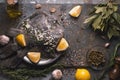 Still life with raw flounders and seasoning on the stone background top view Royalty Free Stock Photo