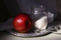 Still life with a red apple, spoon, and sugar Royalty Free Stock Photo