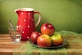 Still life with red apples and jug Royalty Free Stock Photo