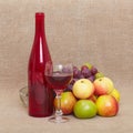 Still-life - red bottle of wine and fruit Royalty Free Stock Photo