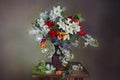 White daffodils and snowdrops in a vase .