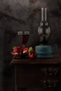Still life with red wine, vintage oil lamp and apples Royalty Free Stock Photo