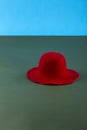 Still life with a red woolen hat on a green table Royalty Free Stock Photo