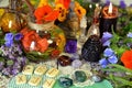 Still life with reiki crystals, runes, black candles and witch herbal potions on table