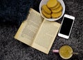 Still life for rest - book, coffee, biscuits and cell phone. Royalty Free Stock Photo