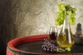 Still life with ripe grapes, wine glasses and wine bottles in old Royalty Free Stock Photo