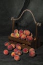 Still life with ripe peaches in a wooden box Royalty Free Stock Photo