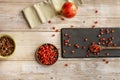 Still life with ripe pomegranate grains on a black slate plate and coconut