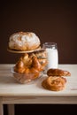 Still life of rolls, bread, baguette and flour on a table Royalty Free Stock Photo