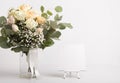 Still life roses in wedding bouquet and easel for creative text Royalty Free Stock Photo