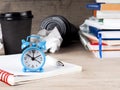 Still life round clock on stack of books. Education and learning concept. Invest time in studies. Time to upgrade ideas. Increase Royalty Free Stock Photo