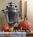 Still life with a Russian samovar and pumpkins. Royalty Free Stock Photo