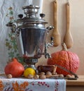 Still life with a Russian samovar and pumpkins. Royalty Free Stock Photo