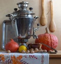 Still life with a Russian samovar and pumpkins. Royalty Free Stock Photo