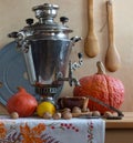 Still life with a Russian samovar and pumpkins. Royalty Free Stock Photo