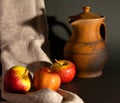 Still life in a rustic style: red apples and a pitcher Royalty Free Stock Photo