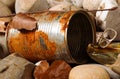 Tin can waste on pebble beach floor closeup Royalty Free Stock Photo