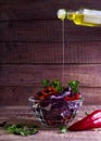 Salad of red cabbage and sweet red pepper, seasoned with lemon juice and olive oil in wooden table Royalty Free Stock Photo