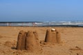 A still life scene on the beach with a sand castle Royalty Free Stock Photo