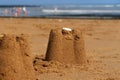 A still life scene at the beach with a sand castle Royalty Free Stock Photo