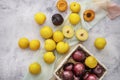 ripe red and yellow plums in a wicker basket Royalty Free Stock Photo