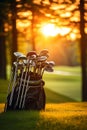 A still life of a set of golf clubs on a green, with the sun setting behind them. Royalty Free Stock Photo