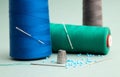 Still life of sewing items, metal sewing thimble finger protector or finger shield thimble, thread rolls. Royalty Free Stock Photo