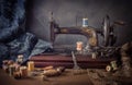Still life with a sewing machine, scissors, threads Royalty Free Stock Photo
