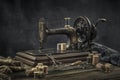 Still life with a sewing machine, scissors, threads Royalty Free Stock Photo