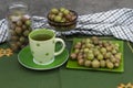 Still life in shades of green. Gooseberry and drink. Royalty Free Stock Photo