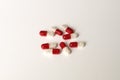 A still life shot of red and white prescription medicines