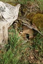 Small wooden fairy house in the forest, close-up Royalty Free Stock Photo