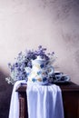 Still life with a Spanish-style coffee pot and purple flowers Royalty Free Stock Photo