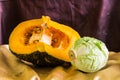 Still life split pumpkin and cabbage Royalty Free Stock Photo