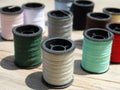 Still life of spools of thread on a wooden background Royalty Free Stock Photo