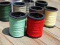 Still life of spools of thread on a wooden background Royalty Free Stock Photo