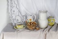 Kitchen still life with bagels ,milk in a jug and tea on the table. Royalty Free Stock Photo