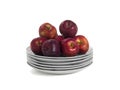 Still life stack of plates with red apples Royalty Free Stock Photo