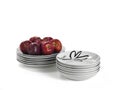 Still life stack of plates with red apples Royalty Free Stock Photo