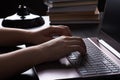 Still life of study or office at night under lamp light. Hands of young woman writer freelance typing on keyboard Royalty Free Stock Photo