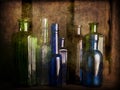 Still Life Study with old glass coloured bottles Royalty Free Stock Photo