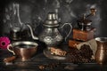 Still life in the style of an old photograph with a coffee grinder, coffee beans with an old lamp and a kettle with a Royalty Free Stock Photo