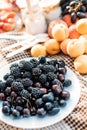 Still life summer picnic blackberry apricot raspberry