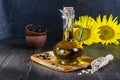 Still life with sunflower oil in glass bottle, seed and sunflower Royalty Free Stock Photo