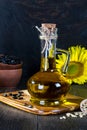 Still life with sunflower oil in glass bottle, seed and sunflower Royalty Free Stock Photo