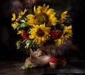 Still life with sunflowers and autumn flowers in a vase