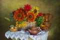 Still life with sunflowers in a basket with embroidered flowers on a towel Royalty Free Stock Photo