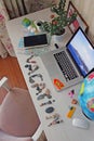 Still life on the table with a laptop and a stone inscription vacation